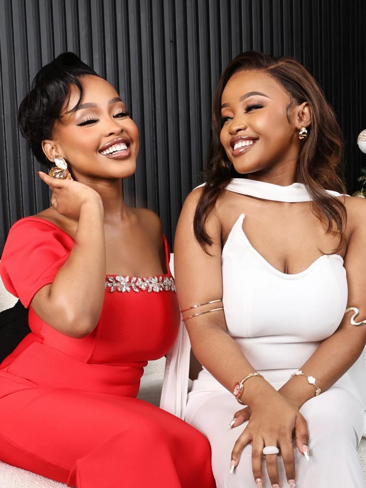 Two women wearing sleek bob and long straight San Hair styles